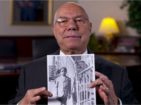 Colin Powell holds a picture of himself at the Automat circa 1943.