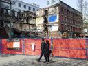 The demolition of the Winters Hotel, destroyed during a fire April 11, was halted after two bodies were found in the rubble Friday.  Police and coroners service continue to investigate.