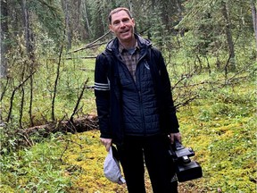 Michael Zelniker filming landscape and wildlife in the boreal forest in northern Alberta for his documentary the Issue with Tissue.