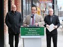 MP Irek Kusmierczyk, centre, speaks during a press conference on Friday, April 1, 2022 regarding financial compensation to local businesses that were impacted by the Ambassador Bridge blockade.  Windsor Mayor Drew Dilkens, left, and Stephen MacKenzie, CEO and President, Invest WindsorEssex look on.