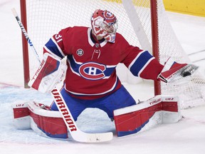 Canadiens goaltender Carey Price gloves the puck against the Florida Panthers in Montreal on Friday, April 29, 2022.