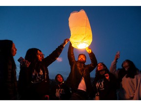Family and friends released lanterns for Karanveer Sahota who was beaten and stabbed to death outside McNally High School during a candlelight vigil held outside his school in Edmonton, on Friday, April 29, 2022. Photo by Ian Kucerak