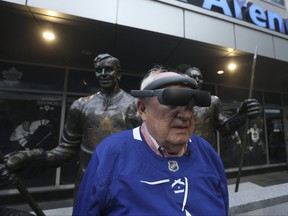 Eric MacDonald, 78, uses an eSight 4 device in preparation to watch the Maple Leafs play on Friday night.  Jack Boland/Toronto Sun/Postmedia Network