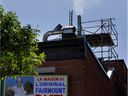 A mix of smoke and vapor exits the chimney at Fairmount Bagel.  Neighbors say the filtration device used at Fairmount, where ovens burn 24 hours a day, breaks down regularly — a claim Fairmount's owner denies.