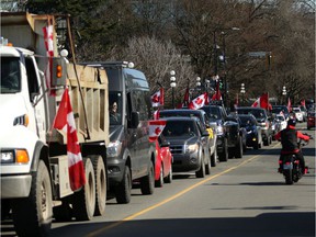 Hundreds of convoy supporters gathered at the BC Legislature to protest COVID-19 mandates in the province while in Victoria, BC, on Saturday, March 5, 2022.