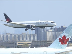 An Air Canada flight from Narita International airport in Tokyo, Japan arrives at Toronto Pearson International airport's Terminal 3 at 2 pm on Friday April 23, 2021. Jack Boland/Toronto Sun/Postmedia Network
