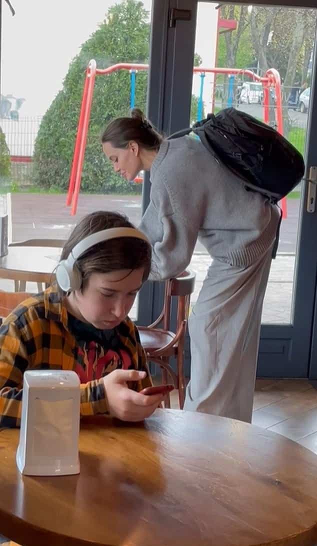 Actress Angelina Jolie shocked Ukrainians after appearing in a cafe in Lviv.  A guy on her phone didn't notice the world-famous actress as she walked into the cafe behind him.