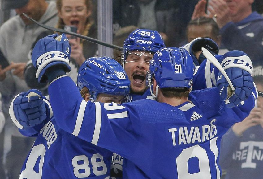 Maple Leafs center Auston Matthews celebrates his 60th goal of the season with William Nylander and John Tavares.