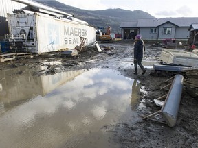 Sumas prairie residents begin the slow process of repairing the damage caused by earlier flooding.  Pictured is Kelsey Mostertman.