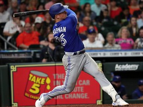 Blue Jays batter Matt Chapman doubles in Vladimir Guerrero Jr. in the ninth inning against the Astros at Minute Maid Park in Houston, Friday, April 22, 2022.