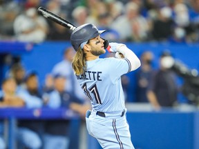 The Blue Jays' Bo Bichette hits a grand slam against the Boston Red Sox in the eighth inning on Monday night at the Rogers Center.