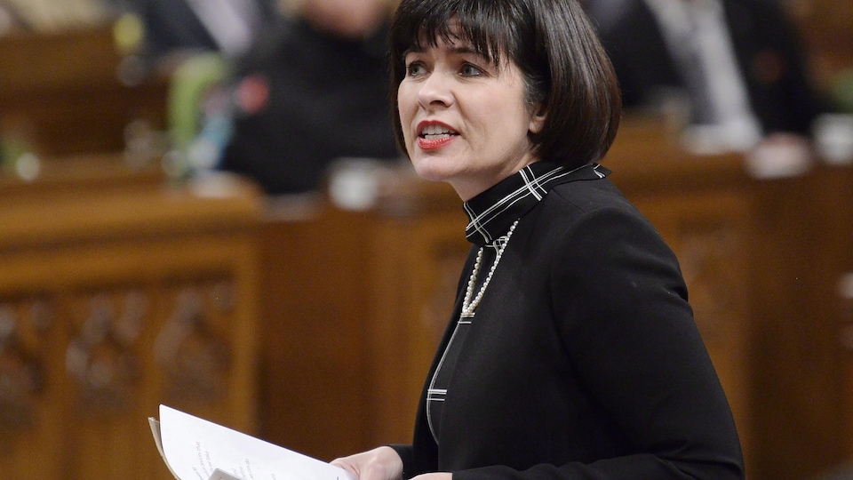 Official Languages ​​Minister Ginette Petitpas Taylor standing in the Chamber.