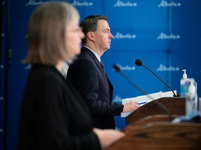 Alberta's Health Minister Jason Copping and Alberta's chief medical officer of health Dr. Deena Hinshaw provide an update on COVID-19 in the province during a news conference in Edmonton on March 23, 2022.