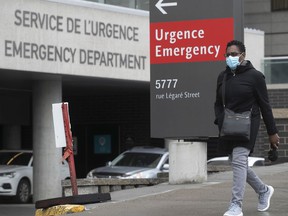 Walking past the emergency entrance at Montreal's Jewish General Hospital on March 31, 2022.