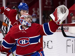 Montreal Canadiens goaltender Carey Price can't reach the puck as defenseman Ben Chiarot heads to the back of the net against the Winnipeg Jets in Montreal on June 7, 2021.
