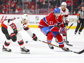 Montreal Canadiens Josh Anderson has the puck knocked off his stick by Ottawa Senators Connor Brown during the first period of the National Hockey League game in Montreal Tuesday April 5, 2022.