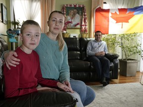 Ukraine citizens Halyna Luchak and her son Oleksandr Luchak, left, at the home of Edmontonian Ivan Lypovyk, right, on April 2, 2022.
