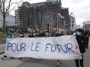 People mark Earth Day with a march, Friday, April 22, 2022 in Montreal.