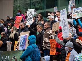 Members of the Nuchatlaht First Nation and supporters rally outside BC Supreme Court before the start of an Indigenous land title case, in Vancouver, on Monday, March 21, 2022.