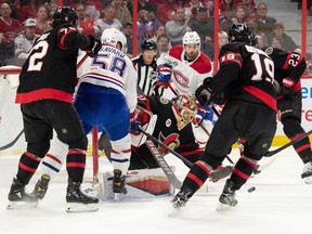 Ottawa Senators goalie Anton Forsberg (31) makes a save in front of Montreal Canadiens defenseman David Savard (58) in the first period at the Canadian Tire Center.