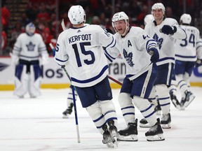 Toronto Maple Leafs forward Alexander Kerfoot is congratulated by teammates after scoring the shootout winner against the Washington Capitals on Sunday night at Capital One Arena.
