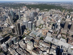 The Montreal skyline is seen in an aerial view from above Old Montreal on July 19, 2018.