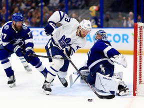 Andrei Vasilevskiy of the Tampa Bay Lightning stops a shot from Kyle Clifford of the Toronto Maple Leafs in the first period during a game at Amalie Arena on April 21, 2022 in Tampa, Florida.