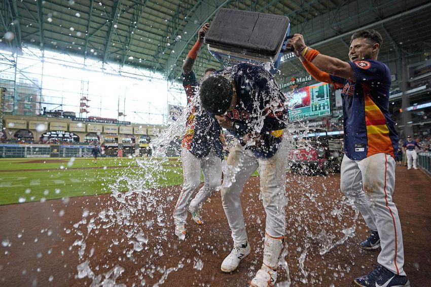 Astros rookie Jeremy Pena cools off after scorching a walk-off homer to win Sunday's game against the Blue Jays in extra innings.