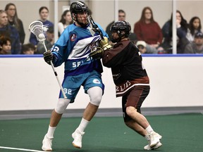Keegan Bell of Sea Spray tries to get around Mathieu Jung of the Grizzlies in the Arena Lacrosse League final last Sunday at the Langley Events Centre.  The Sea Spray won the best-of-three series in three games, Bell scoring the winner in a 2-1 decision in Game 3. The ALL is a feeder league for the NLL.