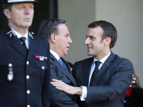 Quebec Premier François Legault shakes hands with French President Emmanuel Macron following a state lunch at the Élysée Palace in Paris on Jan. 21, 2019.