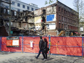 Demolition of the Winters Hotel, destroyed during a fire April 11, was halted after two bodies were found in the rubble.