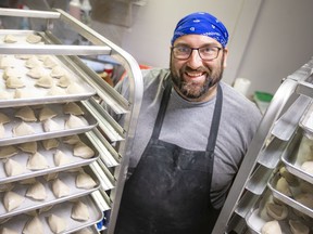Rob Myers, co-owner of Little Foot Foods, is pictured with trays of freshly made pirogies, while at their Tecumseh Road East location, on Tuesday, April 26, 2022. The business is expanding into a 5,000 square foot facility in Oldcastle.