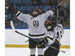 Defenseman Spencer Lecot, left, celebrates with Lee Knight after his goal opened the scoring in Sunday's series finale with the St. Marys Lincolns.