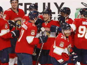 Teammates congratulate Brandon Montour #62 of the Florida Panthers after he scored the winning goal in overtime against the Toronto Maple Leafs at the FLA Live Arena on April 23, 2022 in Sunrise, Florida.