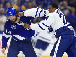 Pat Maroon of the Tampa Bay Lightning and Wayne Simmonds of the Toronto Maple Leafs fight at Amalie Arena on April 21, 2022 in Tampa, Florida.