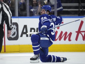 Toronto Maple Leafs center Auston Matthews (34) celebrates after scoring his 60th goal of the season, in the third period against the Detroit Red Wings on Tuesday night at Scotiabank Arena.