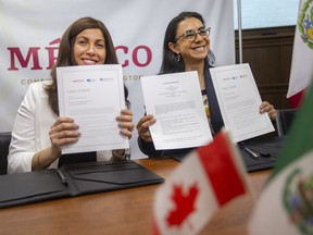 Sabrina DeMarco, left, executive director for the Small Business & Entrepreneurship Centre, and Vanessa Calva, Consul of Mexico for the Consulate of Mexico in Leamington, sign a letter of intent for the partnership to advance gender equality and economic empowerment for women, during a press event at the Mexican consulate, on Monday, April 25, 2022.