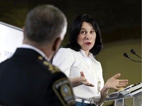 Montreal Mayor Valérie Plante speaks to police chief Sylvain Caron during a news conference at the end of the final day of the Montreal forum to fight armed violence, in Montreal on Thursday, March 31, 2022.
