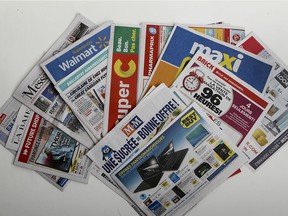 A pile of printed advertising flyers in the Publisac.