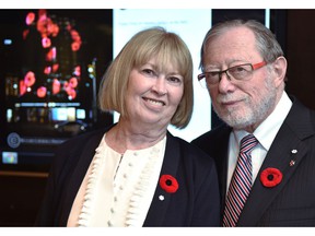 Edmonton philanthropists Dianne and Irving Kipnes standing in front of a poppy display (L) to project onto the National Arts Center in Ottawa, thanks to the Kipnes Lantern which is named after them, in Edmonton, November 7, 2019. Ed Kaiser/Postmedia
