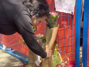 Candice Maclaurin, 37, carefully laid a bouquet of flowers at the site of her former home of seven years, a single room occupancy that went up flames last week, Winters Hotel, from an unattended candle.