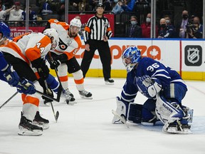Maple Leafs goaltender Jack Campbell defends the goal against Philadelphia Flyers' Nate Thompson during the second period at Scotiabank Arena on Tuesday, April 19, 2022.