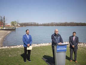 From left, Ray Mensour, Commissioner of community services for the City of Windsor, Mayor Drew Dilkens and Ward 7 councillor Jeewen Gill, hold a press conference to update progress on improvements coming to Sand Point Beach, on Thursday, April 28, 2022.