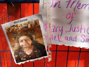 A makeshift memorial Monday for Mary Garlow, meters away from the demolition at the corner of Abbott and Water streets.