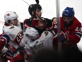 Tim Stuetzle is right in the middle of things as Ottawa Senators and Montreal Canadiens players jostle during the third period at the Bell Center on Tuesday night.