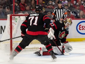 Senators center Chris Tierney (71) looks on as goalie Mads Sogaard (33) makes a save in the first period against the Winnipeg Jets at the Canadian Tire Center on Sunday night.