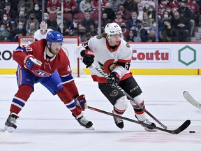 Montreal Canadiens forward Joel Armia (40) takes the puck away from Ottawa Senators forward Tyler Ennis (63) during the third period at the Bell Center.