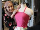 St. Clair College fashion design technician student Aminah Zubaidi works on her summer dress she created, on April 21, 2017. Zubaidi and her classmates are working hard to finish their fashion projects for the annual fashion show. 