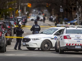 Toronto Police at the scene of a homicide investigation at Ontario St. and Shuter St. in Toronto, Ont.  on Sunday, April 3, 2022.