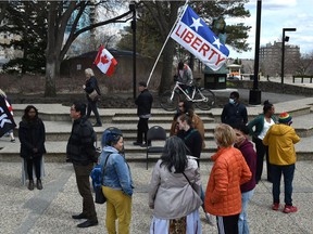 A group of anti-COVID restriction demonstrators marched through a group of Bill 204 supporters outside the Alberta legislature on Saturday, April 30, 2022. Bill 204 would require the government to collect race-based data aimed at spotting disparities in the provision of government services .